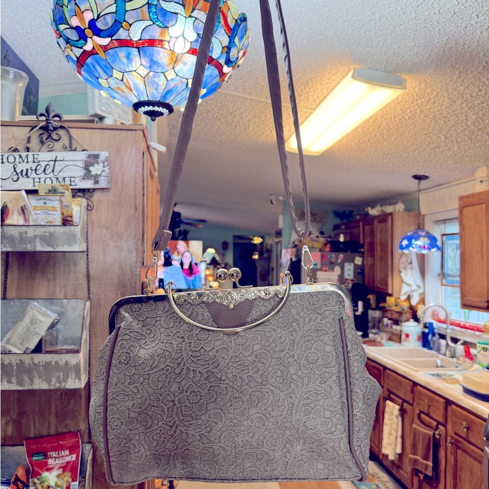 Beautiful lace and leather handbag with strap and beautiful detail